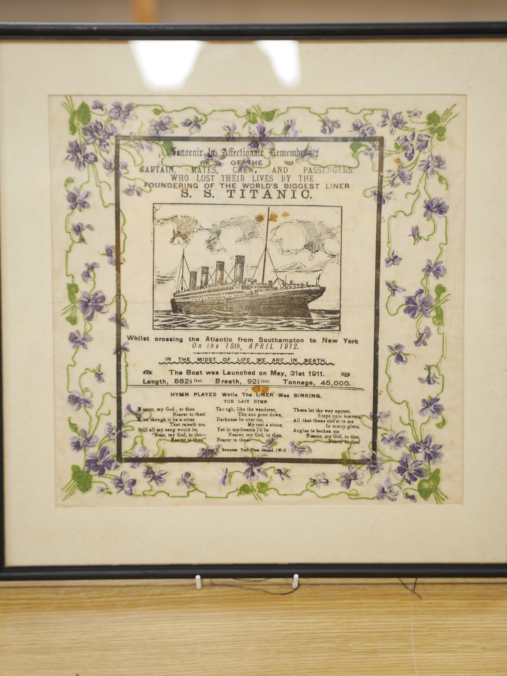 SS Titanic interest, a memorial mourning crepe paper print, 33 x 33cm, framed. Condition - fair